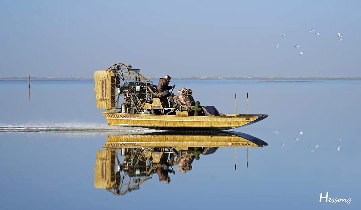 Guide and his hunting party coming in after a morning duck hunt in Port O'Connor TX. Photo by Mike Hessong.